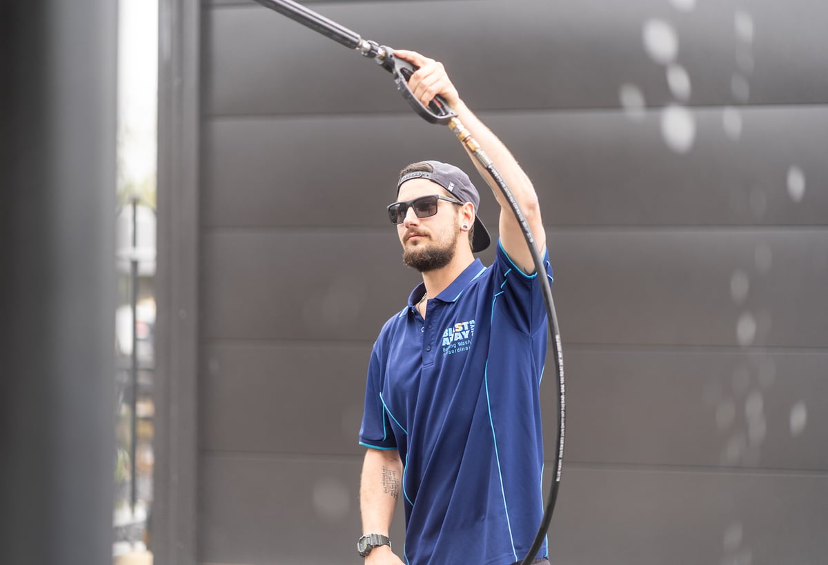 Jeff from Blast Away Guys using exterior cleaning equipment.